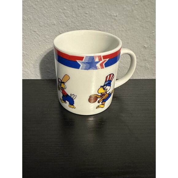 Olympic Coffee MUG Sam Eagle 1982 1984 Patel Soccer Boxing Baseball Basketball - Picture 1 of 3